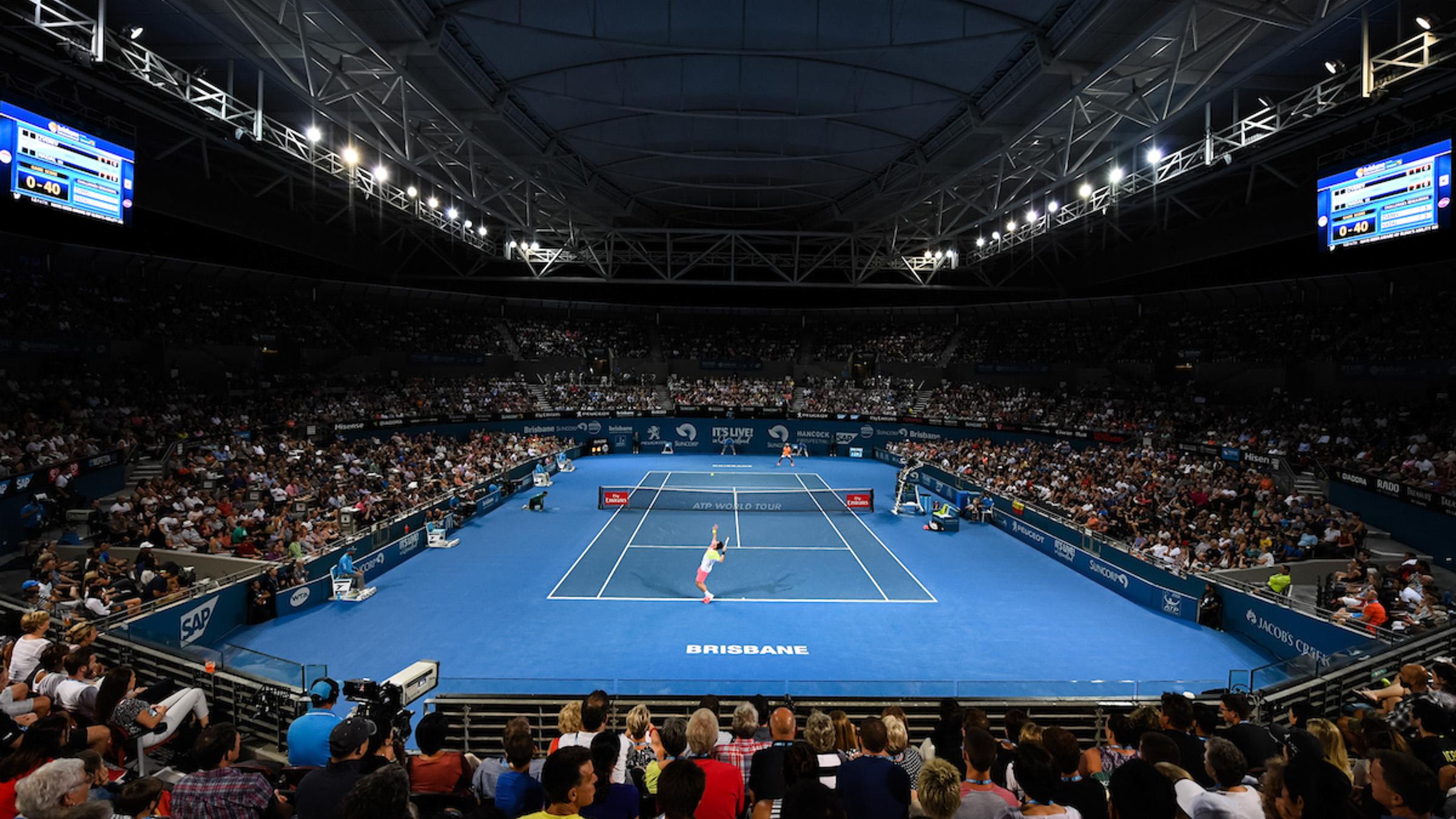 Indoor tennis game in the Queensland tennis stadium filled with people watching