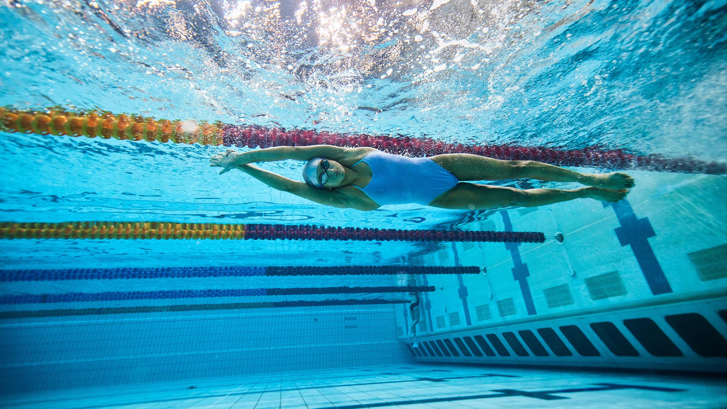 Underwater view of a young athlete, who has just pushed off the pool wall to swim