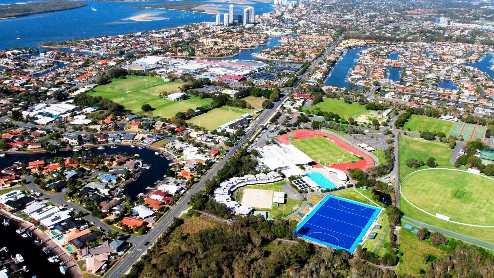 Aerial view of sports facilities with city in background